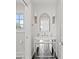 Stylish bathroom with mirrored vanity, marble countertop, and modern fixtures at 140 Brightwaters Ne Blvd, St Petersburg, FL 33704