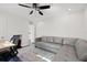 Bright bonus room features a comfortable sectional sofa and a workspace at 140 Brightwaters Ne Blvd, St Petersburg, FL 33704