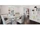 Bright dining area with a unique wood table and white chairs at 140 Brightwaters Ne Blvd, St Petersburg, FL 33704