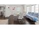 Casual dining area with glass table and light gray sofa at 140 Brightwaters Ne Blvd, St Petersburg, FL 33704