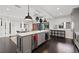 Modern kitchen with gray cabinets and a large island at 140 Brightwaters Ne Blvd, St Petersburg, FL 33704
