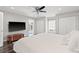 King-size bed, large TV, and access to a private balcony at 140 Brightwaters Ne Blvd, St Petersburg, FL 33704