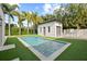 Inviting pool with a spacious patio and detached garage at 140 Brightwaters Ne Blvd, St Petersburg, FL 33704