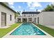 Relaxing rectangular pool surrounded by lush green grass at 140 Brightwaters Ne Blvd, St Petersburg, FL 33704