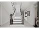 Elegant staircase with dark wood railing and white risers at 140 Brightwaters Ne Blvd, St Petersburg, FL 33704