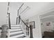 Elegant staircase with dark wood and white railings at 140 Brightwaters Ne Blvd, St Petersburg, FL 33704