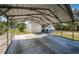 Spacious covered carport providing ample parking and protection for vehicles, next to the house at 215 35Th Ne Ave, St Petersburg, FL 33704