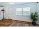Bright entryway featuring hardwood floors, wainscoting, and large windows for natural light at 215 35Th Ne Ave, St Petersburg, FL 33704