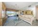 Living area featuring a sofa, coffee table, and balcony view at 2209 Belleair Rd # C15, Clearwater, FL 33764