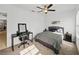 Bedroom with ceiling fan, large windows and grey bedding at 31500 Magna Gulf Loop, San Antonio, FL 33576