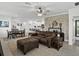 Open living area with a comfortable leather couch and dining space at 31500 Magna Gulf Loop, San Antonio, FL 33576