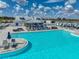 Relaxing pool area with lounge chairs and umbrellas at 31500 Magna Gulf Loop, San Antonio, FL 33576