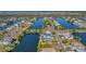 Aerial view showing a waterfront home with private dock and large lot at 3295 Hibiscus Dr, Hernando Beach, FL 34607