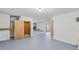 The basement features an open layout with a small elevator and a finished floor, providing versatile space at 3295 Hibiscus Dr, Hernando Beach, FL 34607