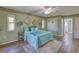 Comfortable bedroom with plush carpeting, modern decor, and natural light for a cozy retreat at 3295 Hibiscus Dr, Hernando Beach, FL 34607