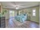 Serene bedroom with a ceiling fan, wood-look floors, balcony and plenty of natural light at 3295 Hibiscus Dr, Hernando Beach, FL 34607