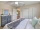 Comfortable bedroom with a neutral color palette, wood-look flooring, and large closet at 3295 Hibiscus Dr, Hernando Beach, FL 34607