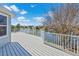 Expansive deck with white railings offers stunning water views and creates a perfect outdoor space at 3295 Hibiscus Dr, Hernando Beach, FL 34607