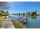 Charming dock on tranquil waters, inviting relaxation and enjoyment of the serene waterfront setting at 3295 Hibiscus Dr, Hernando Beach, FL 34607