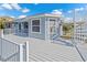 Stylish home exterior featuring a multi-level deck with spiral staircase offering seamless indoor-outdoor living at 3295 Hibiscus Dr, Hernando Beach, FL 34607