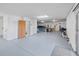 A well lit garage with storage and parking space for multiple vehicles. An EV charger is also visible at 3295 Hibiscus Dr, Hernando Beach, FL 34607