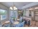 Open-concept kitchen with a breakfast bar, adjoining dining area, and stainless steel appliances at 3295 Hibiscus Dr, Hernando Beach, FL 34607