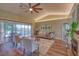Inviting living room features vaulted ceilings, lots of natural light, and a fireplace for cozy evenings at 3295 Hibiscus Dr, Hernando Beach, FL 34607