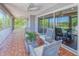 Relaxing covered patio with outdoor seating and scenic views, perfect for entertaining at 3295 Hibiscus Dr, Hernando Beach, FL 34607