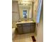 Bathroom with gray vanity and tiled floor at 34185 Canal N Dr, Pinellas Park, FL 33781