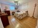 Bright bedroom with floral bedding, wood-look floors, and ample closet space at 34185 Canal N Dr, Pinellas Park, FL 33781