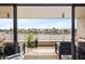 Spacious balcony overlooking waterfront with seating at 6260 Kipps Colony Ct # 204, Gulfport, FL 33707