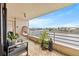 Relaxing balcony with waterfront view and hanging chair at 6260 Kipps Colony Ct # 204, Gulfport, FL 33707