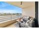 Waterfront balcony with seating and outdoor furniture at 6260 Kipps Colony Ct # 204, Gulfport, FL 33707