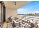 Relaxing balcony with fire pit and water views at 6260 Kipps Colony Ct # 204, Gulfport, FL 33707