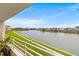 Waterfront balcony with grassy area and seating at 6260 Kipps Colony Ct # 204, Gulfport, FL 33707
