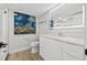 Bathroom with modern vanity and large mirror at 6260 Kipps Colony Ct # 204, Gulfport, FL 33707