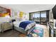 Spacious bedroom with water views and eclectic wall art at 6260 Kipps Colony Ct # 204, Gulfport, FL 33707