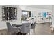 Modern dining room with marble table and grey velvet chairs at 6260 Kipps Colony Ct # 204, Gulfport, FL 33707