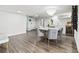 Open concept dining room with wine storage and hardwood floors at 6260 Kipps Colony Ct # 204, Gulfport, FL 33707