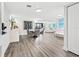 Elegant dining area with modern chandelier and grey velvet chairs at 6260 Kipps Colony Ct # 204, Gulfport, FL 33707