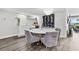 Bright dining area with marble table and modern chandelier at 6260 Kipps Colony Ct # 204, Gulfport, FL 33707