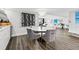 Modern dining room with hardwood floors and wine rack at 6260 Kipps Colony Ct # 204, Gulfport, FL 33707