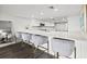 Modern kitchen with white cabinets, quartz countertops, and stainless steel appliances at 6260 Kipps Colony Ct # 204, Gulfport, FL 33707