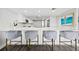 Modern kitchen with white cabinets, quartz countertops, and stainless steel appliances at 6260 Kipps Colony Ct # 204, Gulfport, FL 33707