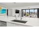 Modern kitchen with white cabinets, quartz countertops and a view at 6260 Kipps Colony Ct # 204, Gulfport, FL 33707