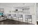 Modern kitchen with white cabinets, quartz countertops, and stainless steel appliances at 6260 Kipps Colony Ct # 204, Gulfport, FL 33707