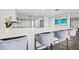 Modern kitchen with white cabinets, quartz countertops, and stainless steel appliances at 6260 Kipps Colony Ct # 204, Gulfport, FL 33707
