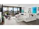 Bright living room with water views, sectional sofa, and hardwood floors at 6260 Kipps Colony Ct # 204, Gulfport, FL 33707