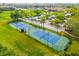 Aerial view of two well-maintained tennis courts at 6260 Kipps Colony Ct # 204, Gulfport, FL 33707