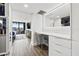 Bright vanity area with built-in drawers and large mirror at 6260 Kipps Colony Ct # 204, Gulfport, FL 33707